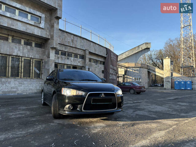 Черный Мицубиси Лансер, объемом двигателя 2 л и пробегом 236 тыс. км за 6450 $, фото 3 на Automoto.ua