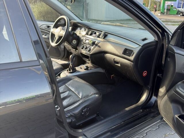 Чорний Міцубісі Lancer, об'ємом двигуна 1.6 л та пробігом 364 тис. км за 3000 $, фото 9 на Automoto.ua