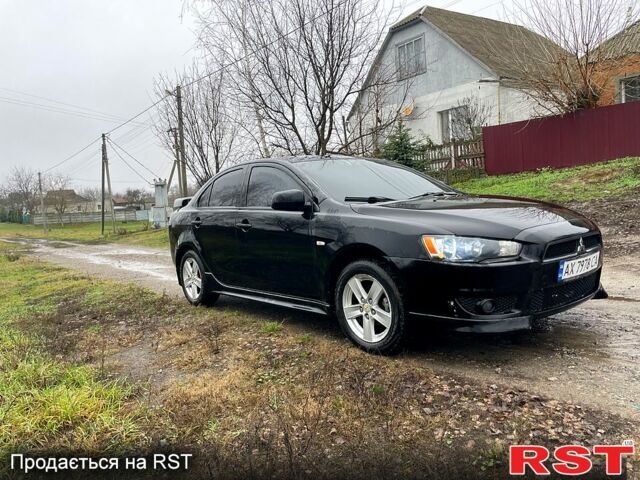 Черный Мицубиси Лансер, объемом двигателя 2 л и пробегом 226 тыс. км за 6600 $, фото 2 на Automoto.ua