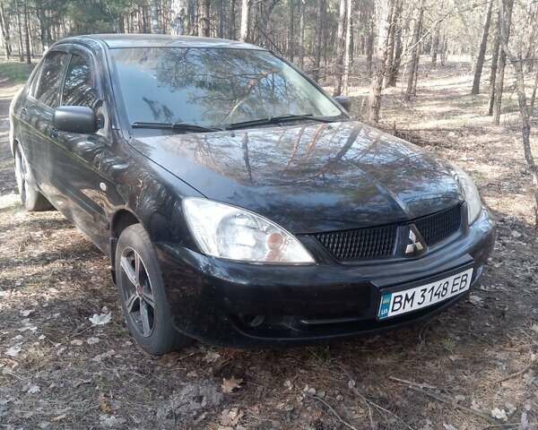 Чорний Міцубісі Lancer, об'ємом двигуна 1.58 л та пробігом 190 тис. км за 4450 $, фото 3 на Automoto.ua