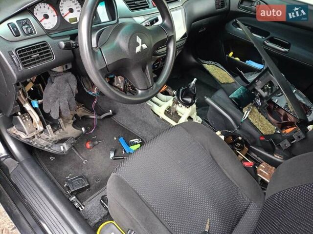 Мицубиси Лансер 2008 в Львове на Automoto.ua Черный Мицубиси Лансер, объемом двигателя 1.58 л и пробегом 200 тыс. км за 5200 $, фото 41 на Automoto.ua