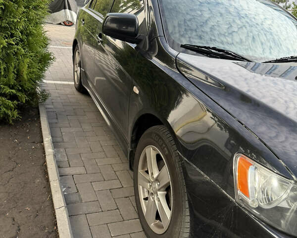 Чорний Міцубісі Lancer, об'ємом двигуна 2 л та пробігом 215 тис. км за 6700 $, фото 2 на Automoto.ua