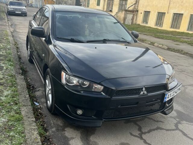 Черный Мицубиси Лансер, объемом двигателя 2 л и пробегом 270 тыс. км за 5600 $, фото 5 на Automoto.ua