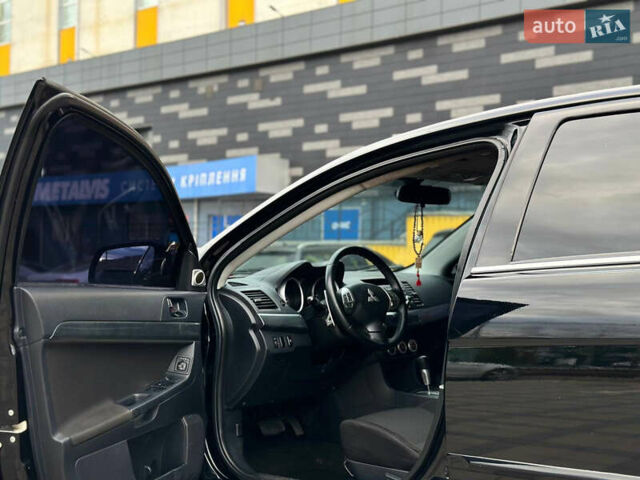 Черный Мицубиси Лансер, объемом двигателя 2 л и пробегом 236 тыс. км за 7950 $, фото 5 на Automoto.ua