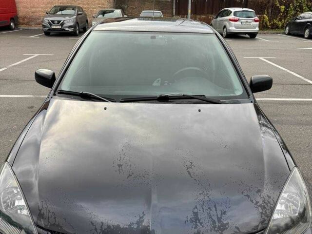 Чорний Міцубісі Lancer, об'ємом двигуна 1.6 л та пробігом 245 тис. км за 4500 $, фото 1 на Automoto.ua