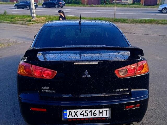 Черный Мицубиси Лансер, объемом двигателя 2 л и пробегом 156 тыс. км за 7100 $, фото 5 на Automoto.ua