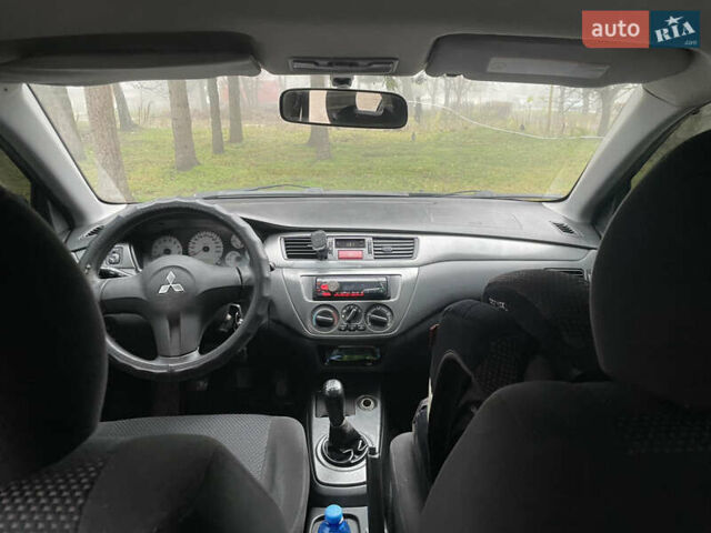 Черный Мицубиси Лансер, объемом двигателя 1.58 л и пробегом 214 тыс. км за 4400 $, фото 20 на Automoto.ua