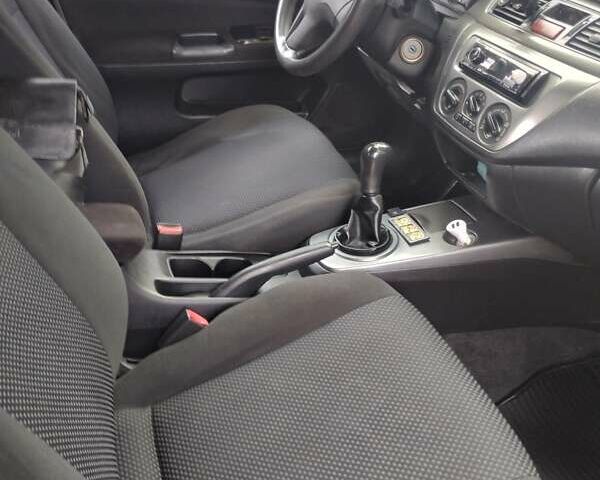 Чорний Міцубісі Lancer, об'ємом двигуна 1.58 л та пробігом 323 тис. км за 4500 $, фото 5 на Automoto.ua