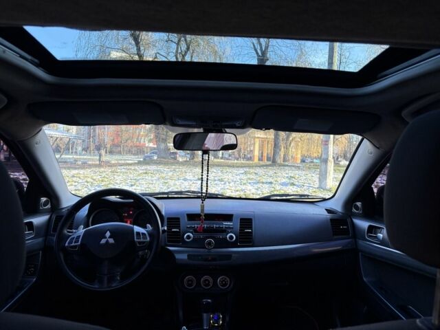 Черный Мицубиси Лансер, объемом двигателя 2 л и пробегом 236 тыс. км за 6550 $, фото 6 на Automoto.ua