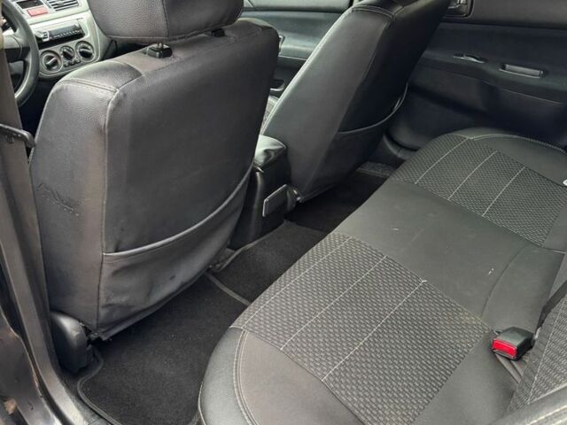 Чорний Міцубісі Lancer, об'ємом двигуна 1.6 л та пробігом 220 тис. км за 3600 $, фото 12 на Automoto.ua
