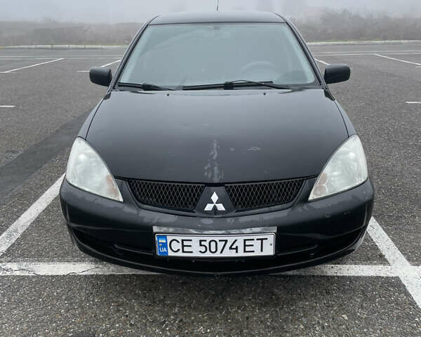 Черный Мицубиси Лансер, объемом двигателя 1.58 л и пробегом 214 тыс. км за 4400 $, фото 5 на Automoto.ua