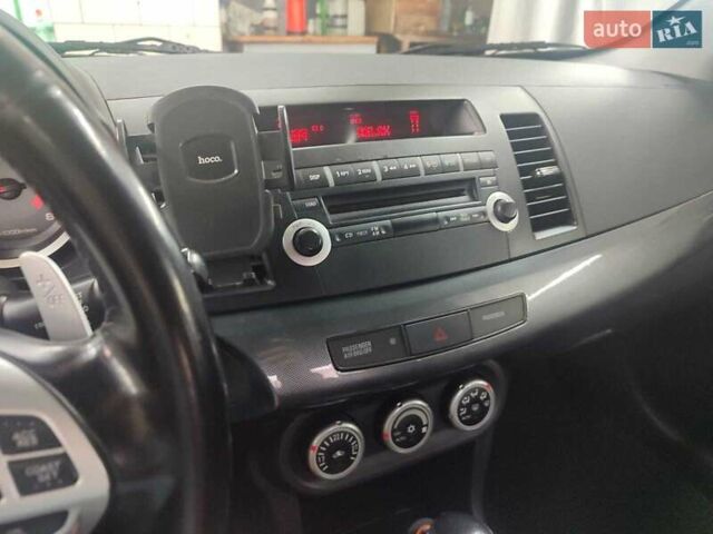 Черный Мицубиси Лансер, объемом двигателя 2 л и пробегом 229 тыс. км за 7300 $, фото 10 на Automoto.ua