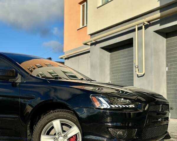 Черный Мицубиси Лансер, объемом двигателя 2 л и пробегом 150 тыс. км за 7850 $, фото 13 на Automoto.ua