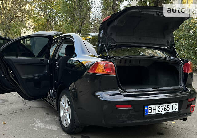 Чорний Міцубісі Lancer, об'ємом двигуна 2 л та пробігом 206 тис. км за 5600 $, фото 56 на Automoto.ua