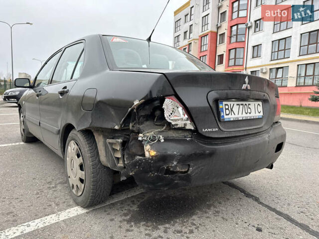 Чорний Міцубісі Lancer, об'ємом двигуна 1.58 л та пробігом 388 тис. км за 2300 $, фото 6 на Automoto.ua