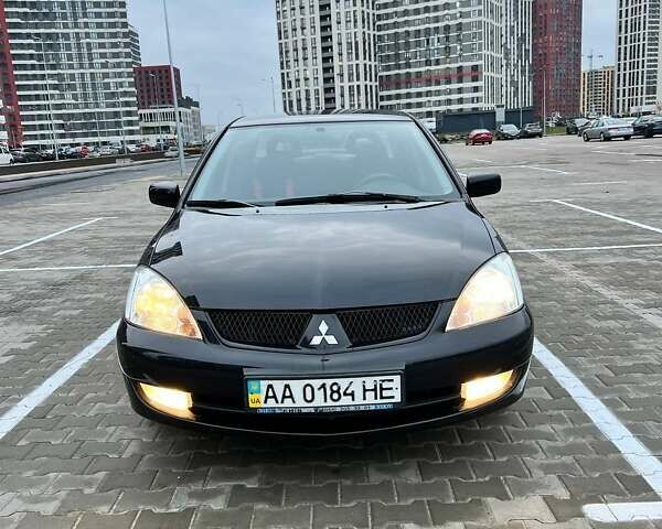 Чорний Міцубісі Lancer, об'ємом двигуна 1.6 л та пробігом 300 тис. км за 5500 $, фото 13 на Automoto.ua