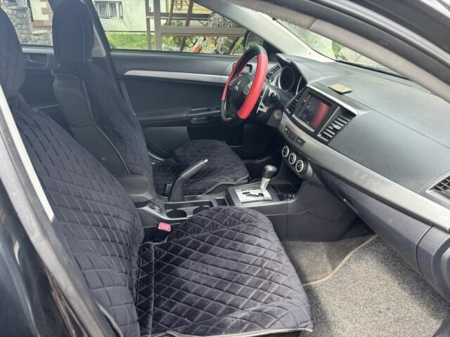 Черный Мицубиси Лансер, объемом двигателя 2 л и пробегом 210 тыс. км за 6250 $, фото 14 на Automoto.ua