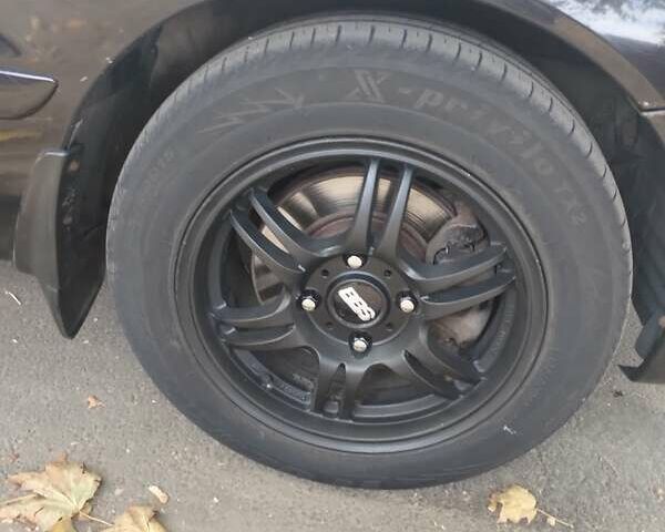 Чорний Міцубісі Lancer, об'ємом двигуна 1.58 л та пробігом 323 тис. км за 4500 $, фото 7 на Automoto.ua