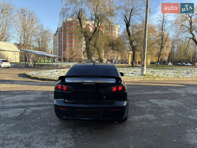 Черный Мицубиси Лансер, объемом двигателя 2 л и пробегом 236 тыс. км за 6450 $, фото 5 на Automoto.ua