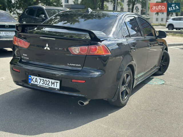 Черный Мицубиси Лансер, объемом двигателя 2 л и пробегом 295 тыс. км за 7000 $, фото 3 на Automoto.ua