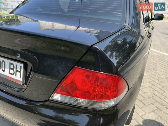 Чорний Міцубісі Lancer, об'ємом двигуна 1.6 л та пробігом 296 тис. км за 4200 $, фото 21 на Automoto.ua