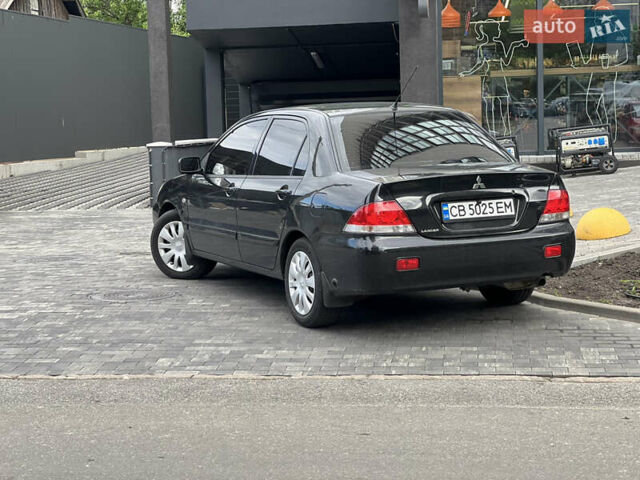 Черный Мицубиси Лансер, объемом двигателя 1.6 л и пробегом 167 тыс. км за 4850 $, фото 1 на Automoto.ua
