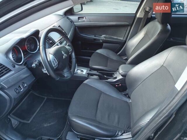 Черный Мицубиси Лансер, объемом двигателя 2 л и пробегом 245 тыс. км за 5600 $, фото 7 на Automoto.ua