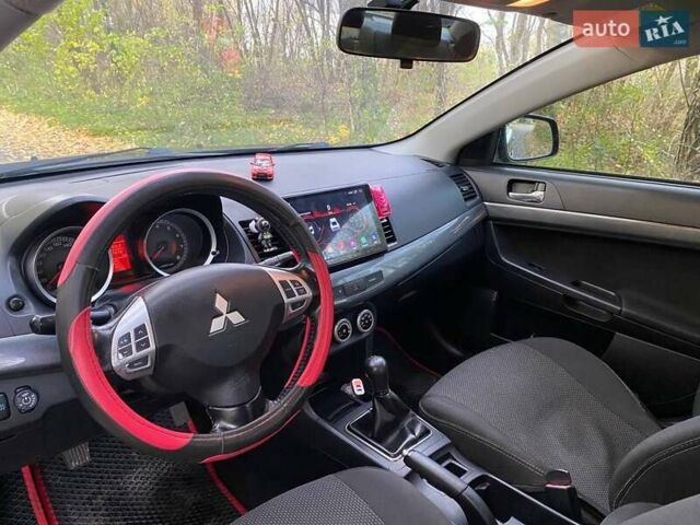 Чорний Міцубісі Lancer, об'ємом двигуна 2 л та пробігом 237 тис. км за 7500 $, фото 14 на Automoto.ua