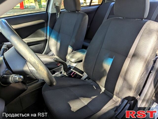 Черный Мицубиси Лансер, объемом двигателя 1.5 л и пробегом 235 тыс. км за 5250 $, фото 7 на Automoto.ua