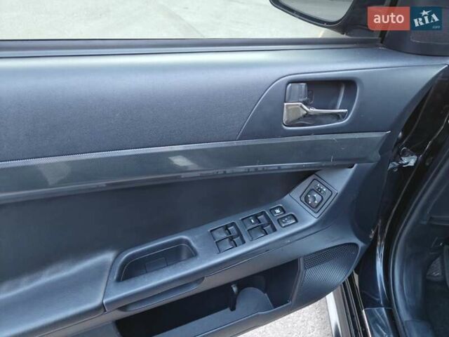 Черный Мицубиси Лансер, объемом двигателя 2 л и пробегом 245 тыс. км за 5600 $, фото 11 на Automoto.ua