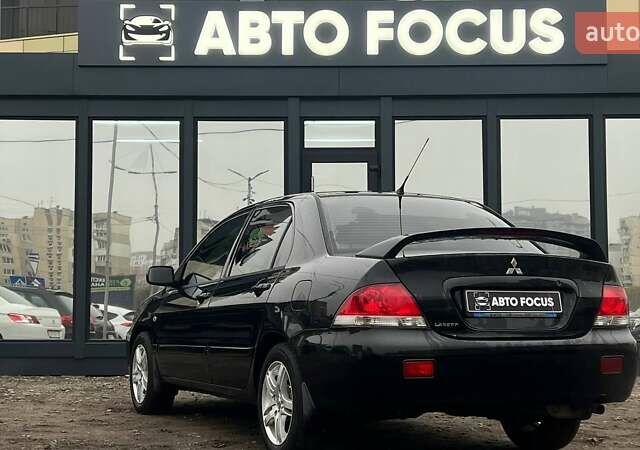 Чорний Міцубісі Lancer, об'ємом двигуна 1.6 л та пробігом 340 тис. км за 6190 $, фото 4 на Automoto.ua