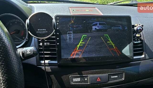 Черный Мицубиси Лансер, объемом двигателя 1.5 л и пробегом 205 тыс. км за 6300 $, фото 3 на Automoto.ua