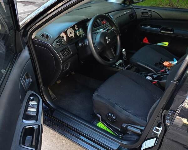 Мицубиси Лансер 2008 в Львове на Automoto.ua Черный Мицубиси Лансер, объемом двигателя 1.58 л и пробегом 200 тыс. км за 5200 $, фото 99 на Automoto.ua