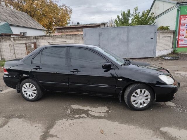 Черный Мицубиси Лансер, объемом двигателя 1.6 л и пробегом 270 тыс. км за 3800 $, фото 2 на Automoto.ua