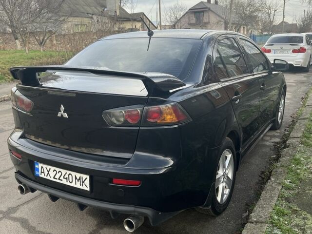 Черный Мицубиси Лансер, объемом двигателя 2 л и пробегом 270 тыс. км за 5600 $, фото 8 на Automoto.ua