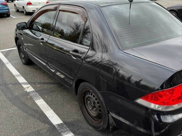 Чорний Міцубісі Lancer, об'ємом двигуна 1.6 л та пробігом 245 тис. км за 4500 $, фото 10 на Automoto.ua