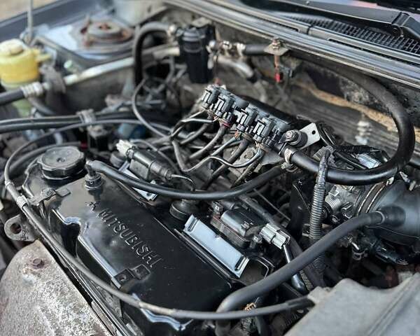 Черный Мицубиси Лансер, объемом двигателя 1.6 л и пробегом 225 тыс. км за 3400 $, фото 18 на Automoto.ua