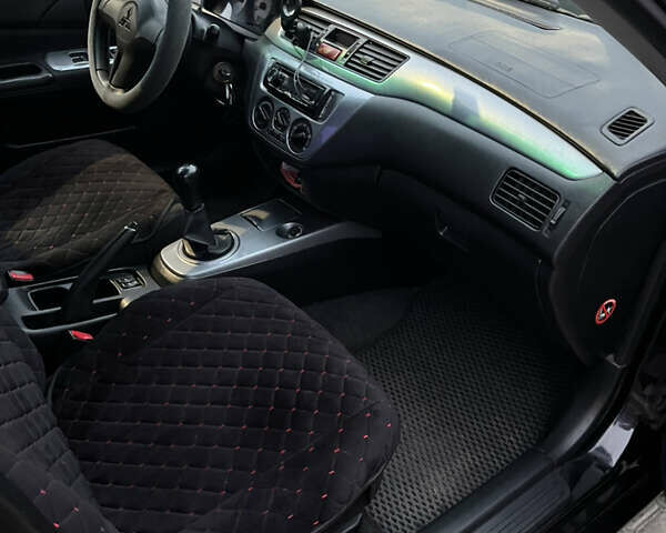 Чорний Міцубісі Lancer, об'ємом двигуна 1.6 л та пробігом 277 тис. км за 3900 $, фото 4 на Automoto.ua