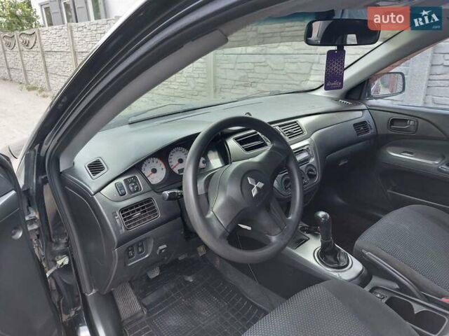 Чорний Міцубісі Lancer, об'ємом двигуна 1.6 л та пробігом 215 тис. км за 4900 $, фото 10 на Automoto.ua