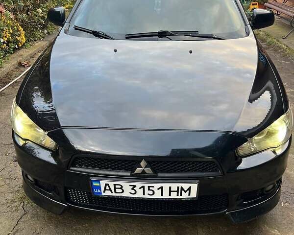 Черный Мицубиси Лансер, объемом двигателя 2 л и пробегом 214 тыс. км за 6300 $, фото 7 на Automoto.ua