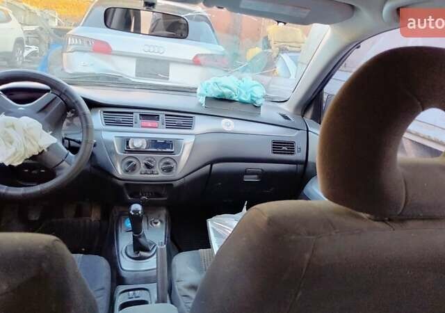 Черный Мицубиси Лансер, объемом двигателя 1.6 л и пробегом 200 тыс. км за 2000 $, фото 9 на Automoto.ua