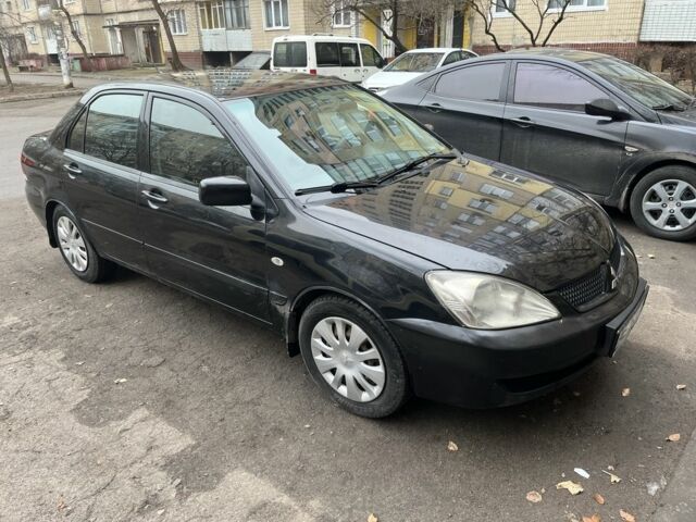 Чорний Міцубісі Lancer, об'ємом двигуна 1.6 л та пробігом 250 тис. км за 3900 $, фото 6 на Automoto.ua
