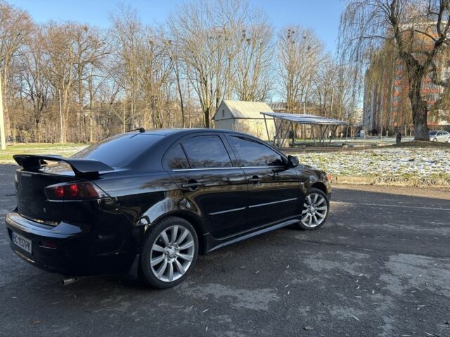 Черный Мицубиси Лансер, объемом двигателя 2 л и пробегом 236 тыс. км за 6550 $, фото 4 на Automoto.ua