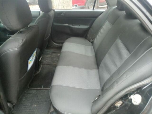 Черный Мицубиси Лансер, объемом двигателя 6 л и пробегом 190 тыс. км за 4500 $, фото 7 на Automoto.ua