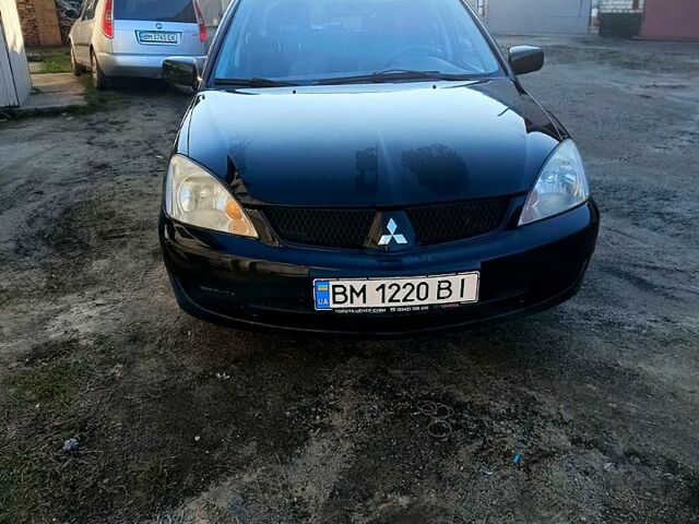 Черный Мицубиси Лансер, объемом двигателя 1.6 л и пробегом 230 тыс. км за 4700 $, фото 2 на Automoto.ua