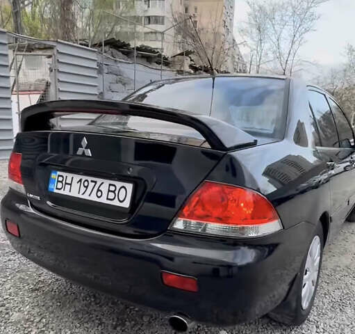 Черный Мицубиси Лансер, объемом двигателя 1.58 л и пробегом 469 тыс. км за 4600 $, фото 1 на Automoto.ua