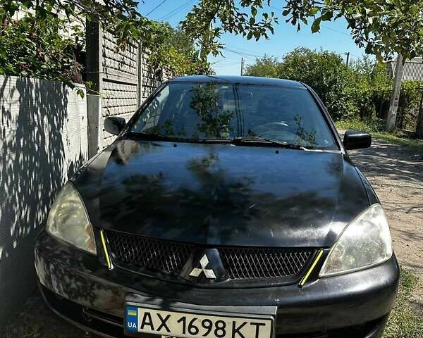 Чорний Міцубісі Lancer, об'ємом двигуна 1.6 л та пробігом 294 тис. км за 6500 $, фото 7 на Automoto.ua