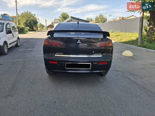 Черный Мицубиси Лансер, объемом двигателя 2 л и пробегом 230 тыс. км за 7000 $, фото 20 на Automoto.ua