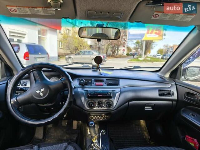 Черный Мицубиси Лансер, объемом двигателя 1.6 л и пробегом 358 тыс. км за 4300 $, фото 11 на Automoto.ua