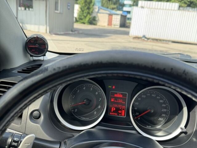 Черный Мицубиси Лансер, объемом двигателя 2 л и пробегом 145 тыс. км за 8900 $, фото 11 на Automoto.ua